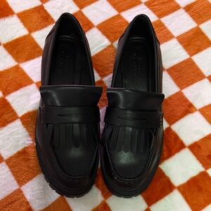 Black Loafers with Fringe Detail